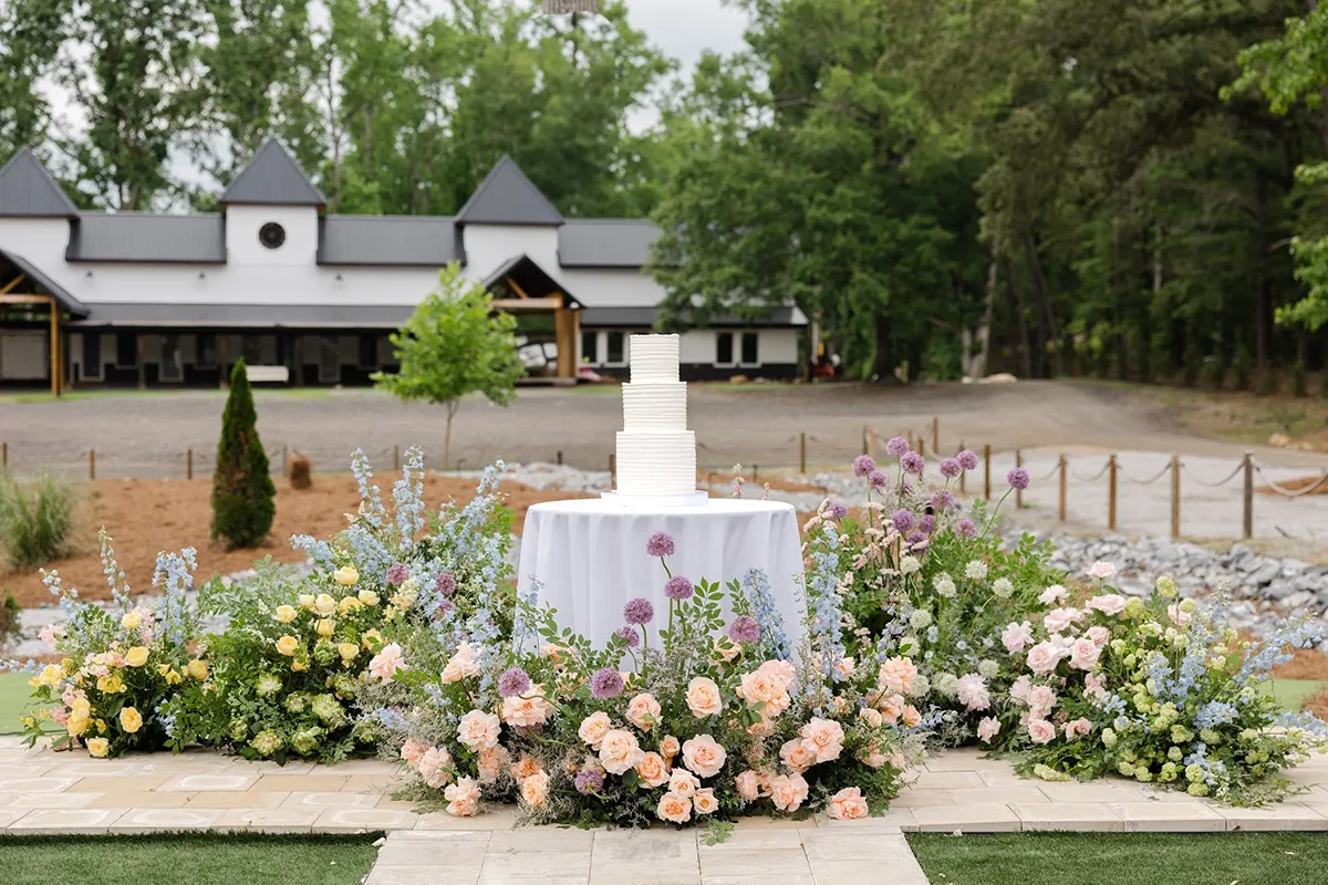 Upstate SC Wedding Venues: Greenville, Spartanburg & Beyond 4 Wedding cake surrounded by flowers.