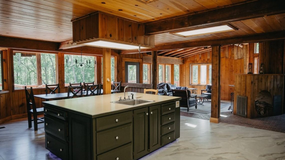 Old Mill Village Camp 10 Cozy wooden cabin interior with kitchen