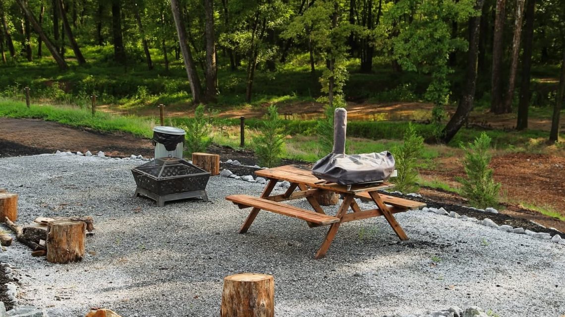 Old Mill Village Camp 8 Picnic area with fire pit and seating