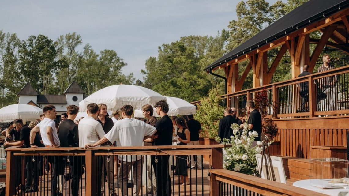 Old Mill Wedding Packages 3 Young people are gathered for an outdoor wedding in Campobello, SC